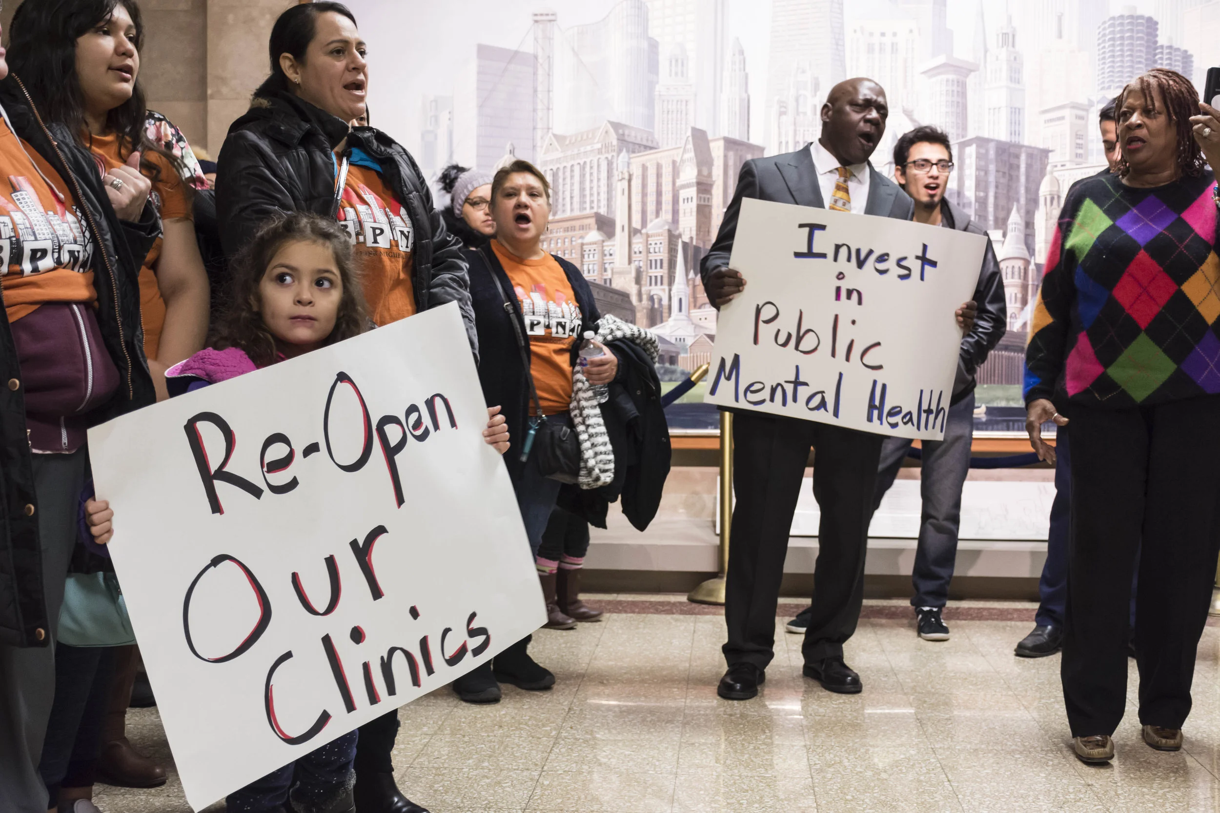  Members of the Brighton Park Neighborhood Council hold a rally and press conference at City Hall on November 14th, 2018, with city officlals present, to demand a vote on budget amendment to redirect $25 Million to citywide trauma-informed mental hea