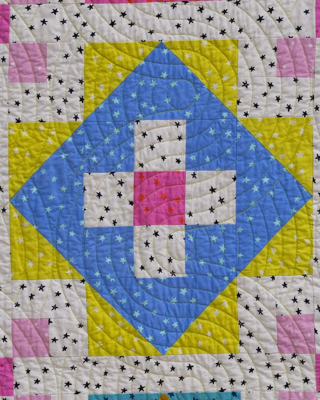 I tend to design with stars. If you've followed my patterns for a while, you've probably noticed &mdash; lots of points, lots of complexity, lots of templates. With this one, I wanted to do something different. More open. Bigger pieces of fabric allo