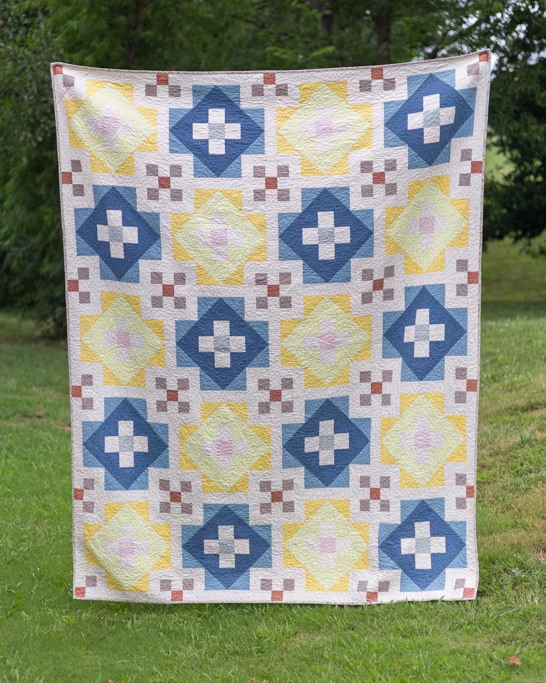 Same pattern. Completely different feeling.⁣
⁣
This is Clover Patch made for my daughter, to celebrate her graduation &mdash; soft blues, mustard, and warm clay instead of Starry's punch of color. None of those are colors I'd normally reach for. They