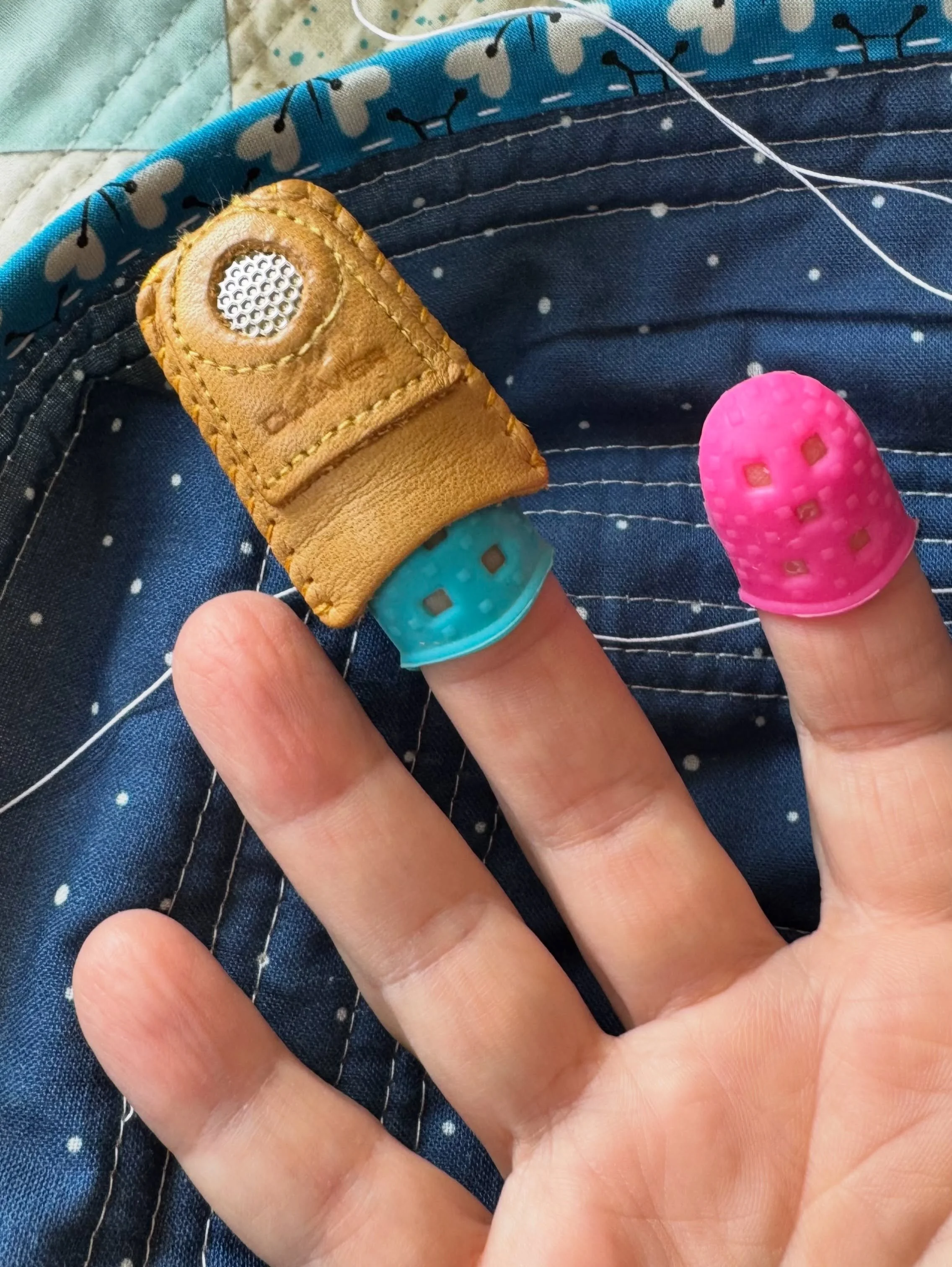 I can&rsquo;t be the only one who needs this hack!

I&rsquo;m deep in hand sewing my quilt bindings in place &amp; find that the leather thimble with the metal &ldquo;coin&rdquo; is a must &mdash; only it&rsquo;s too big for me &amp; I haven&rsquo;t 