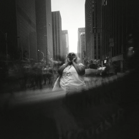 I took this photo with my pinhole camera at the 2014 Climate March in NYC. It was not, at the time, a photo about race, but to me the image has always felt like it speaks to what any fight with power is up against. No wonder we have a story about Dav