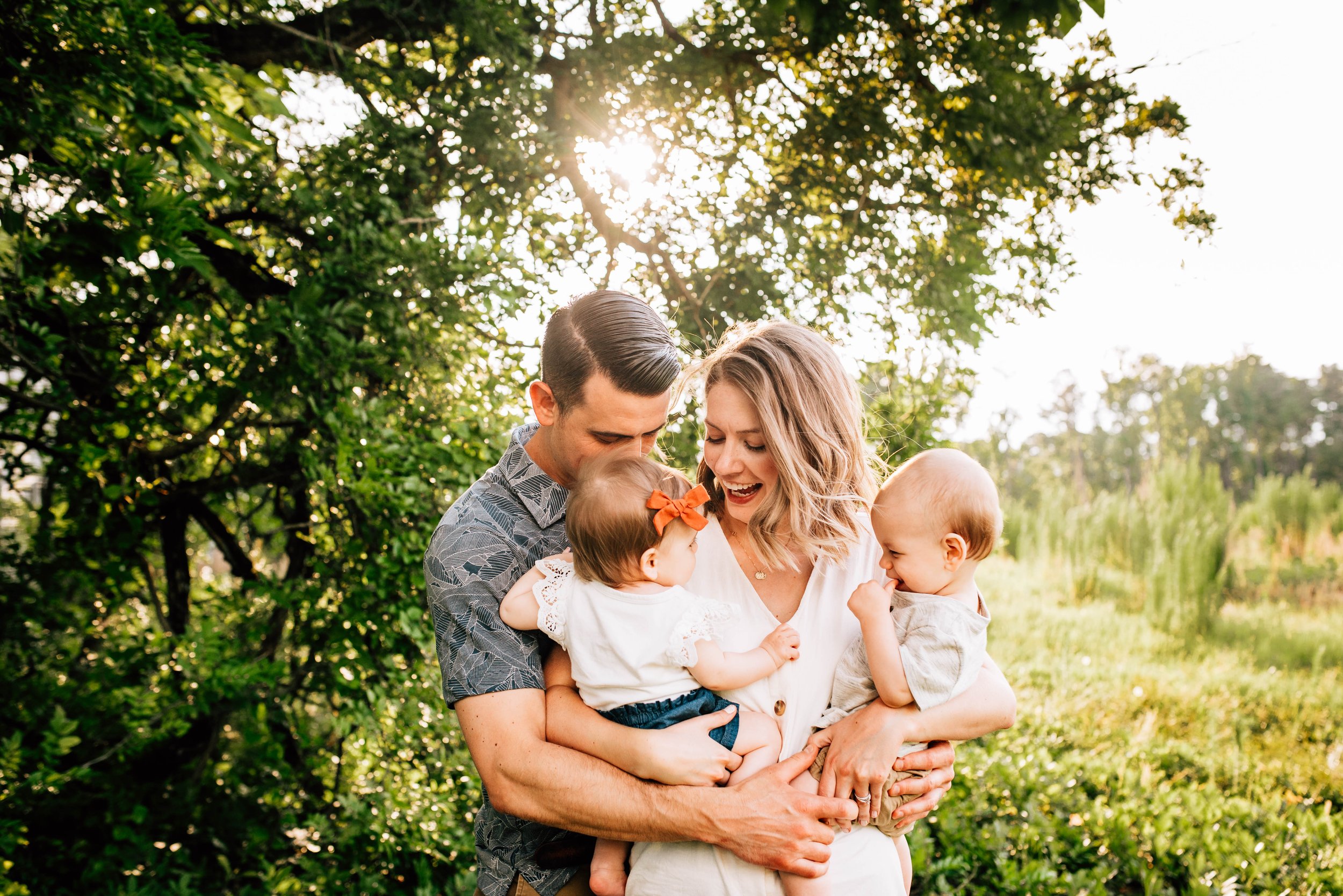 Happy family smiling holding twins