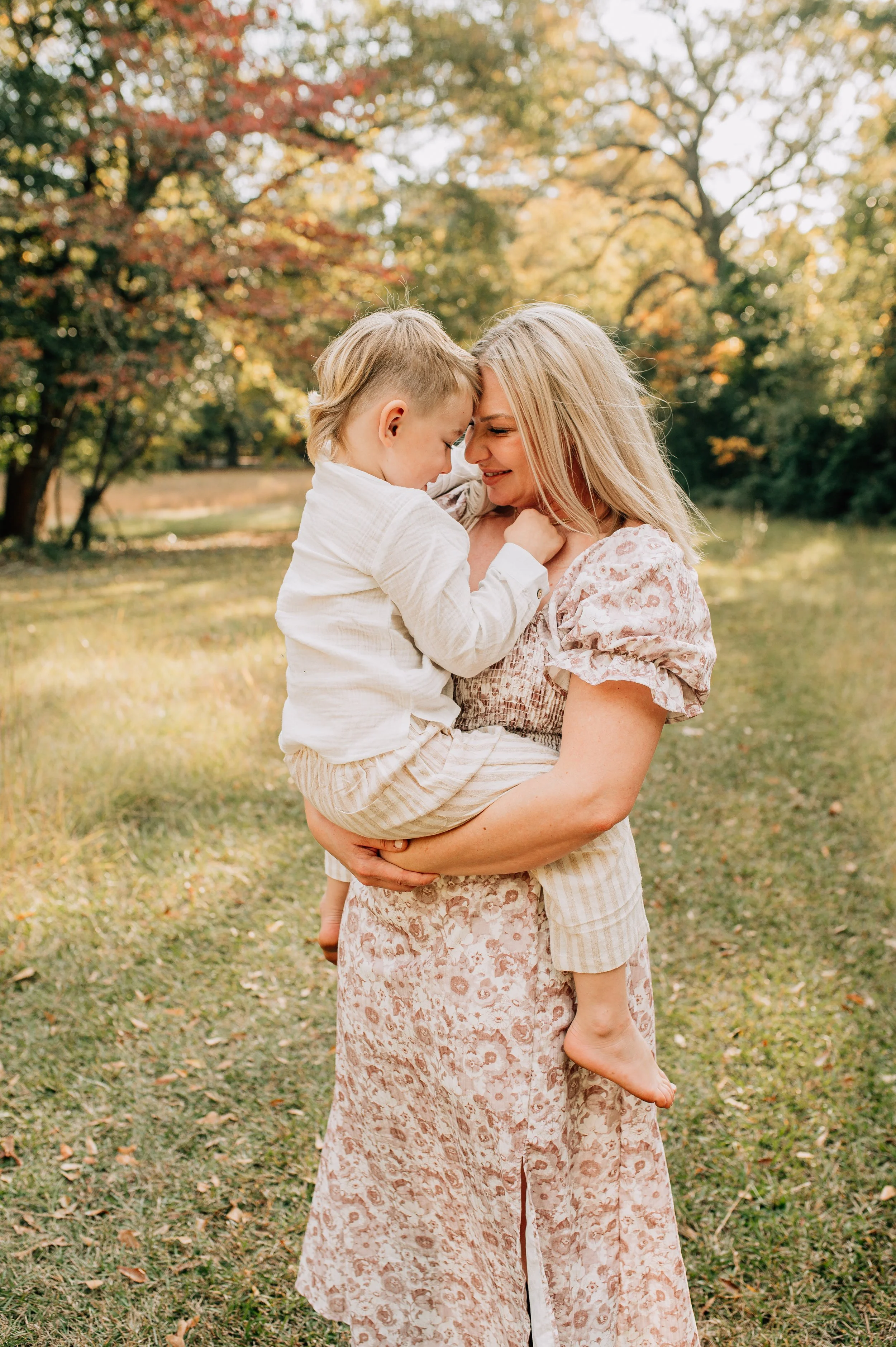 mother holding toddler son in her arms