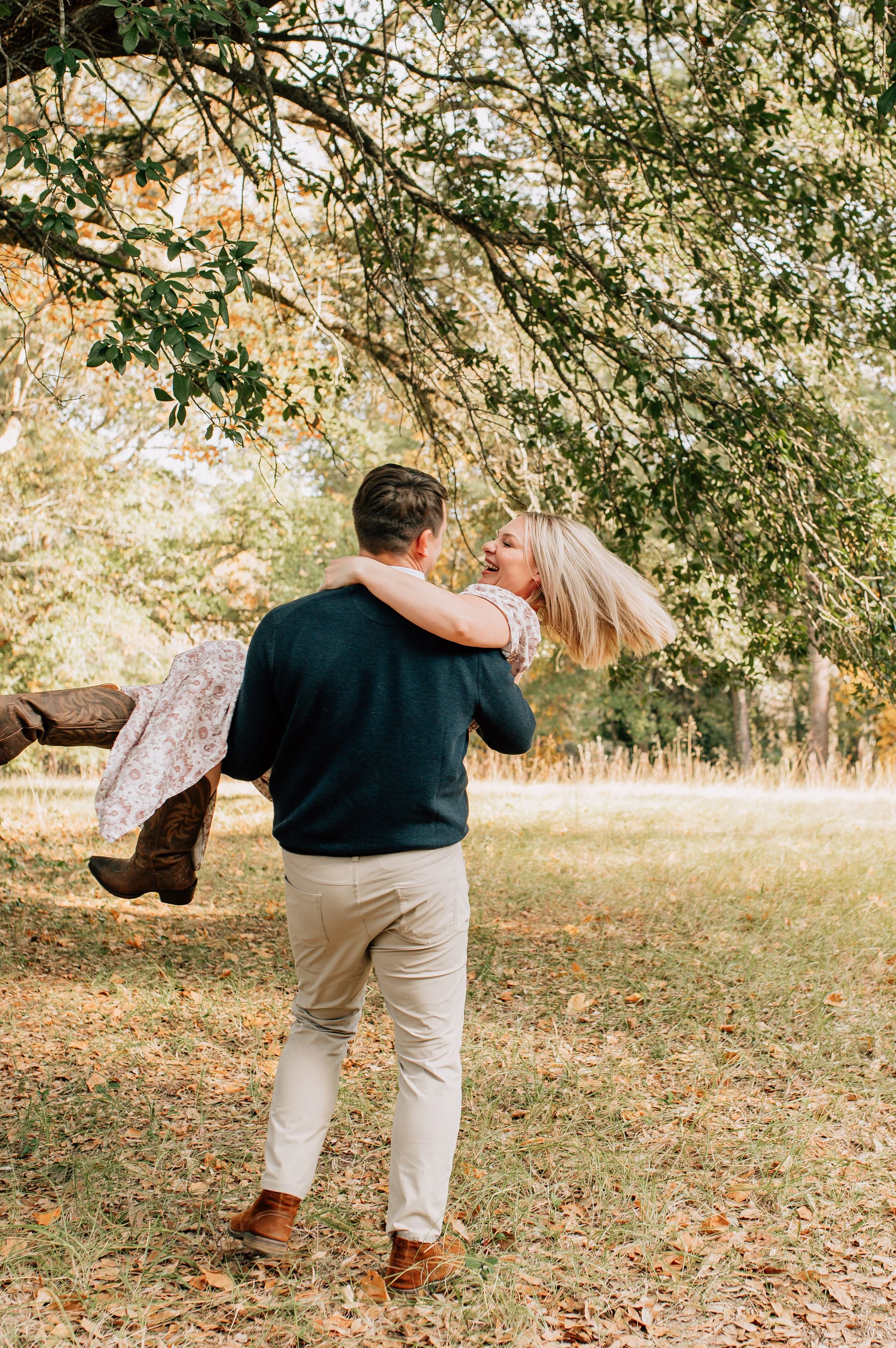 man spinning woman in his arms