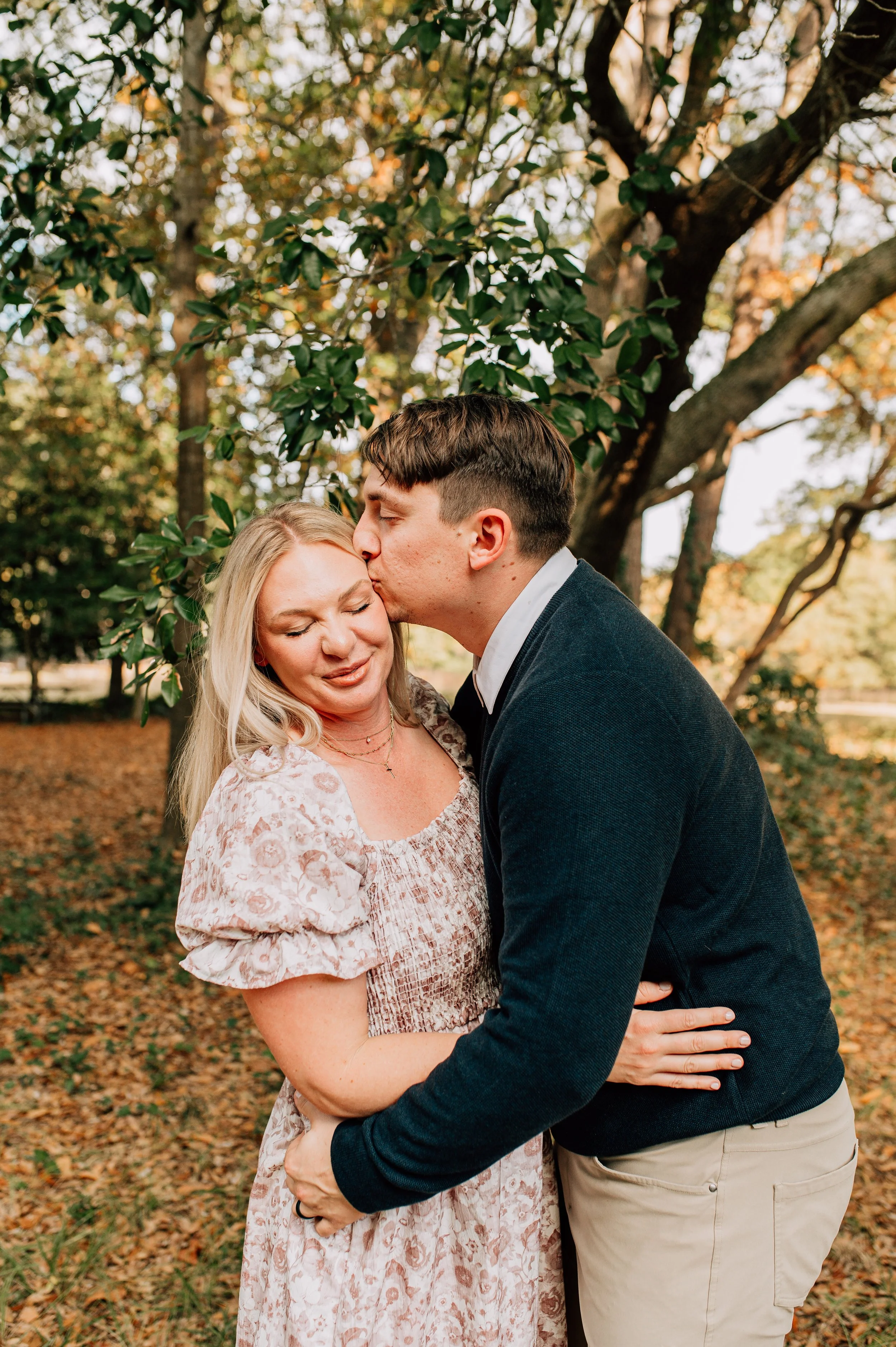 Man kissing woman on cheek
