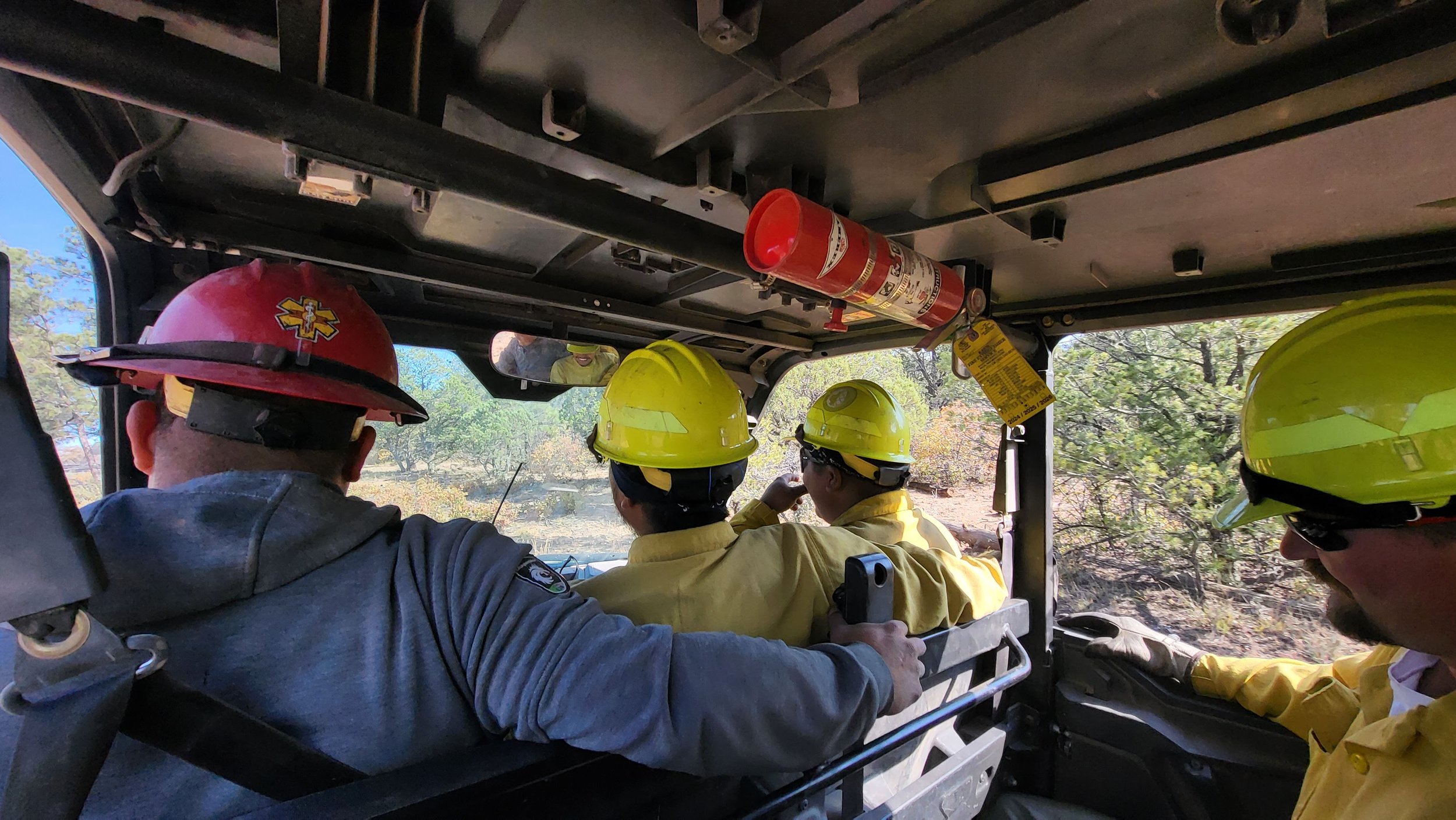  Fire personnel patrol the fire containment lines in an ATV. 
