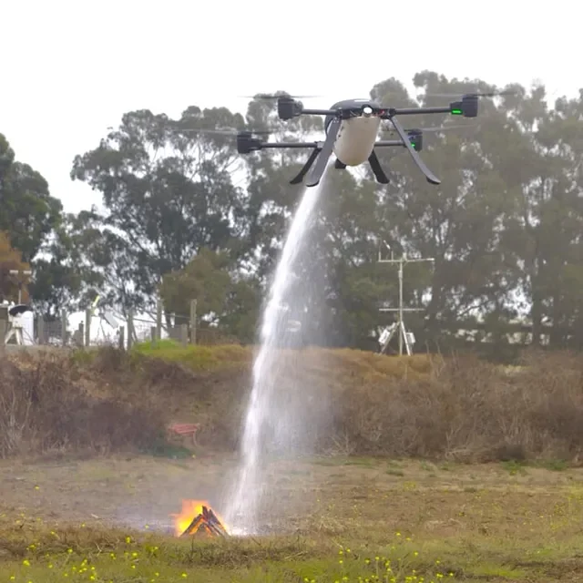 Seneca drone dispensing water to put out a spot fire.