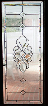  Panel in entry door, lead and bevel with geometric lines and central bevel cluster, lead lines 