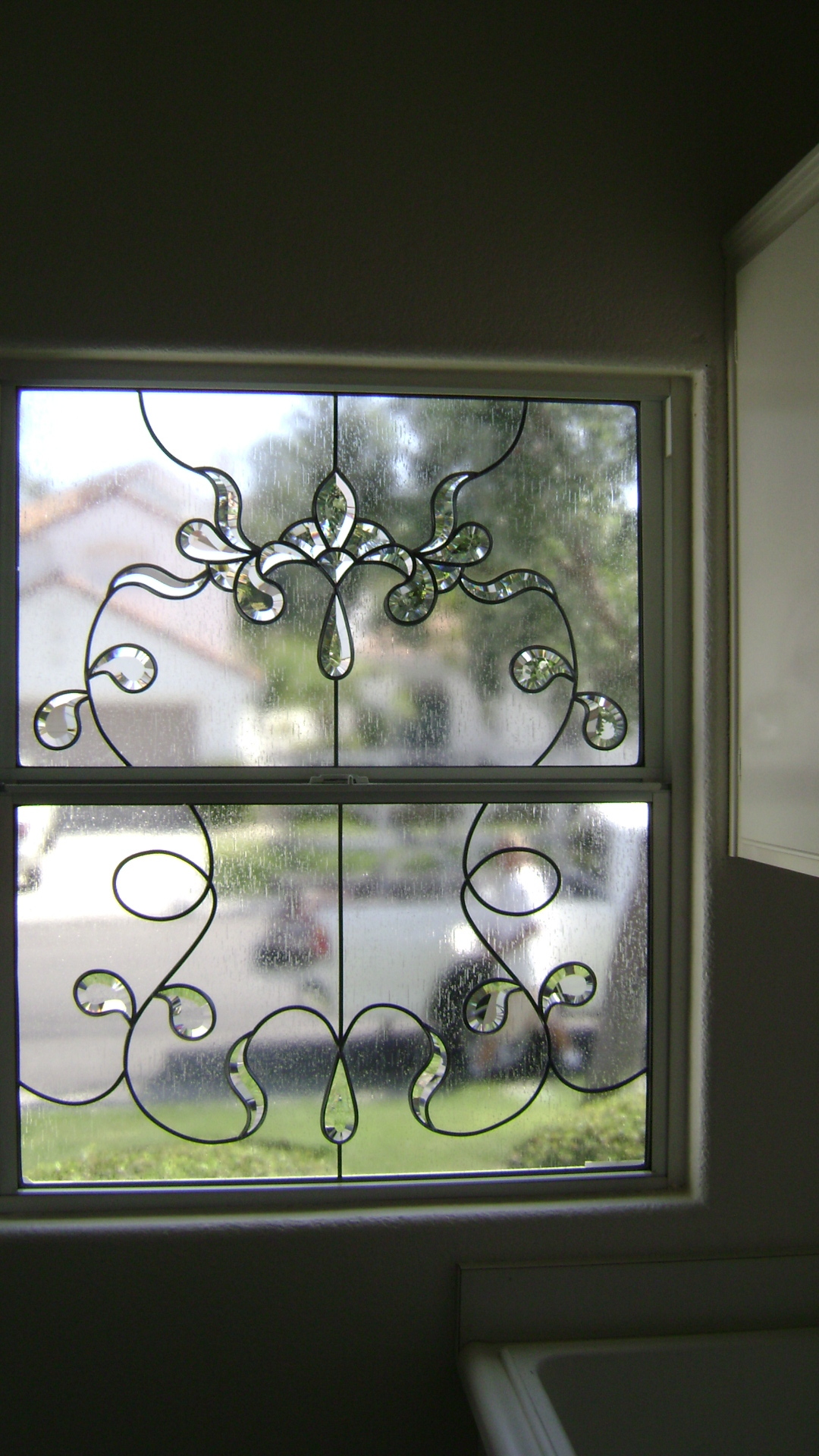  Laundry room single hung window. Lead and bevel swirling deisgn while still being able to see through the window 