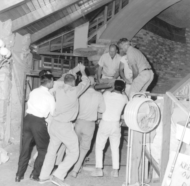 Lifting rock into place over entrance to Copper Cafe