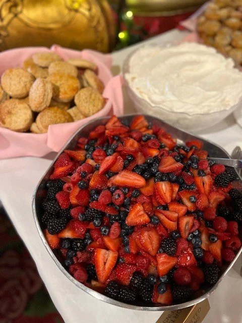 bowl of mixed berries, sweet biscuits, and a bowl of whipped cream