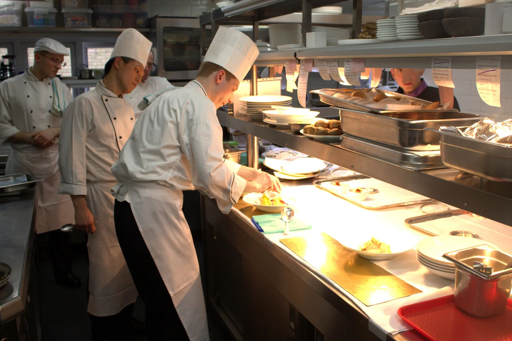 Johannes Nuding, one of the two executive chefs at Sketch, plates