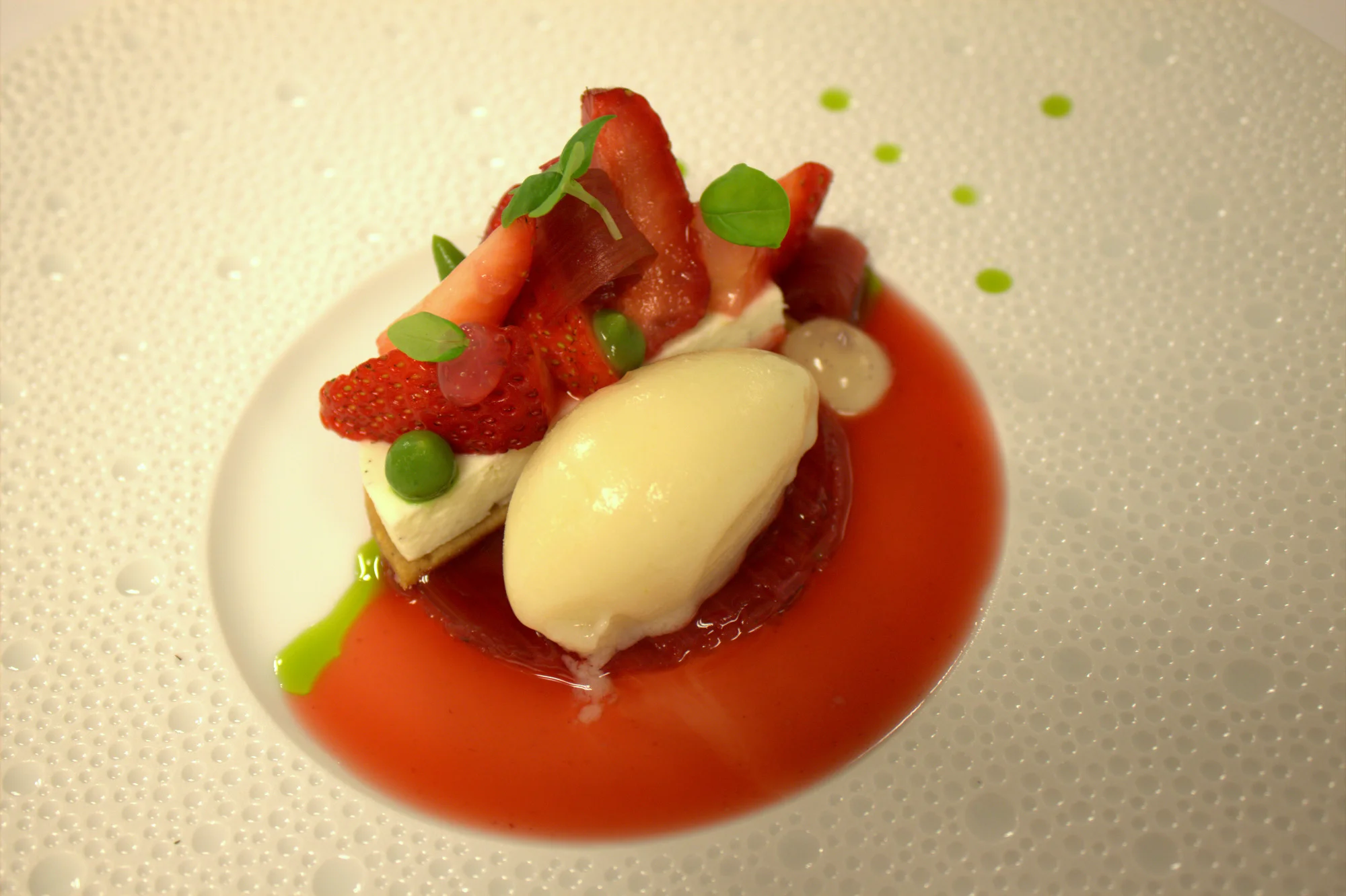 Gariguette strawberries, rhubarb, biscuit, Tonja bean cream, basil purée, salt and lemon sorbet.