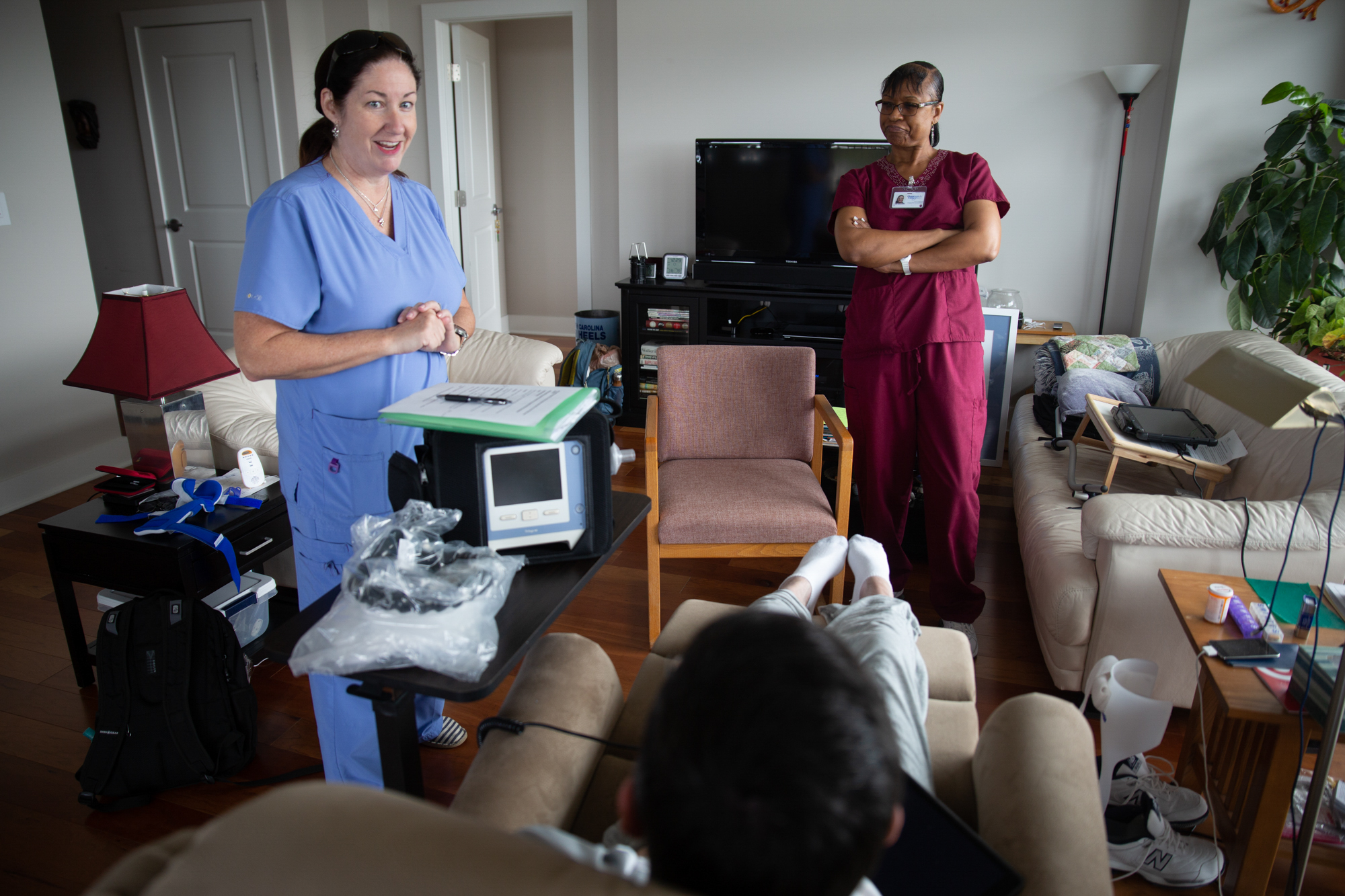  Most weeks, Dr. Ross receives new technology to cope with his ALS, which is why Rebecca West dropped by the apartment with a new breathing machine. Lora Bradley sasses Dr. Ross while West jokes about death.  “There are so many people going in and ou