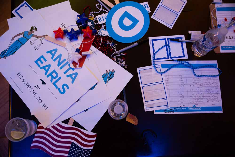  A pile of abandoned voting day materials advocating for Anita Earls lays abandoned on a table at the North Carolina Democratic Party headquarters in Raleigh on election night Nov. 8.  “I became an attorney because I grew up in a mixed race family,” 