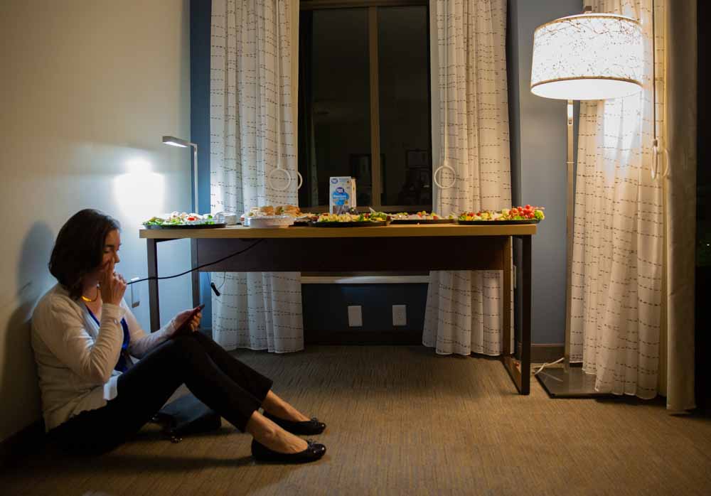  On election day, Nov. 6, Earls sits alone in front of a food table before her “war room” party at a hotel in downtown Raleigh. The rest of her campaign staff are taking up the rest of the chairs in the suite doing work.  “I’m really nervous. I have 