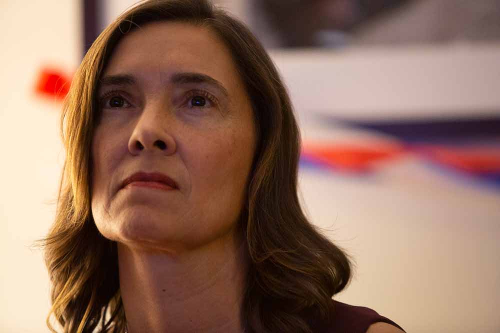  Anita Earls nervously watches the results from other state races come in on the television on election night, waiting for her own race to be called. 
