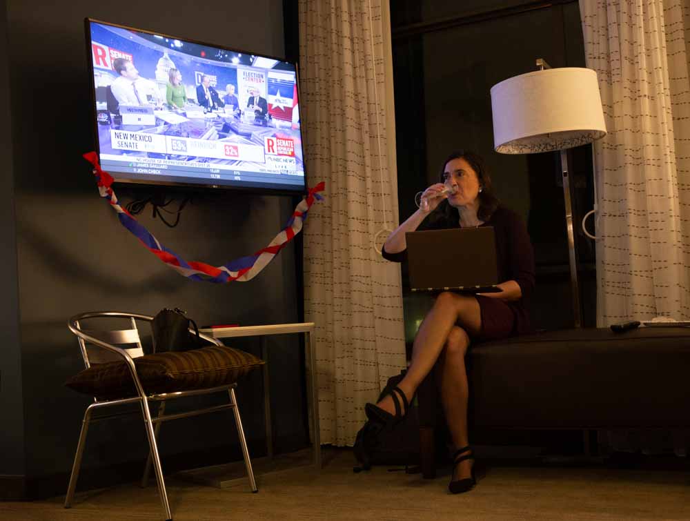  Even after midnight on election night, Anita Earls doesn’t relax, despite her victory. She continues researching how undeclared races are being counted while she drinks champagne.  “In the words of Nelson Mandela, ‘After climbing a great hill, one o