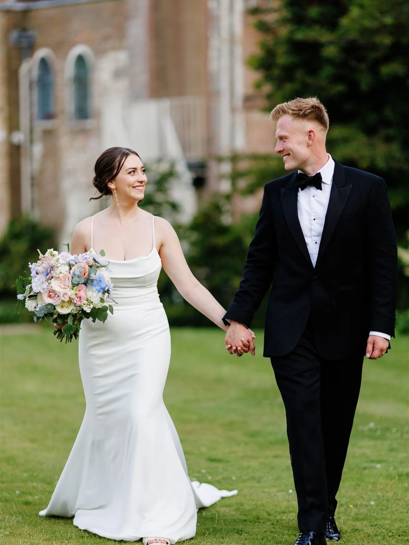 From our very first chat, I knew Lex and Harry&rsquo;s day was going to be something truly special. 

A summer solstice celebration at Farnham Castle, elegant, flower-filled, and full of heartfelt moments.

From the black-tie suits and sage green bri