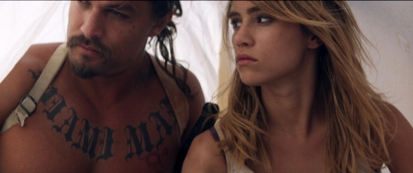 Still from The Bad Batch . Jason Momoa as Miami Man and Suki Waterhouse as Arlen. Courtesy of NEON's press kit for the film.