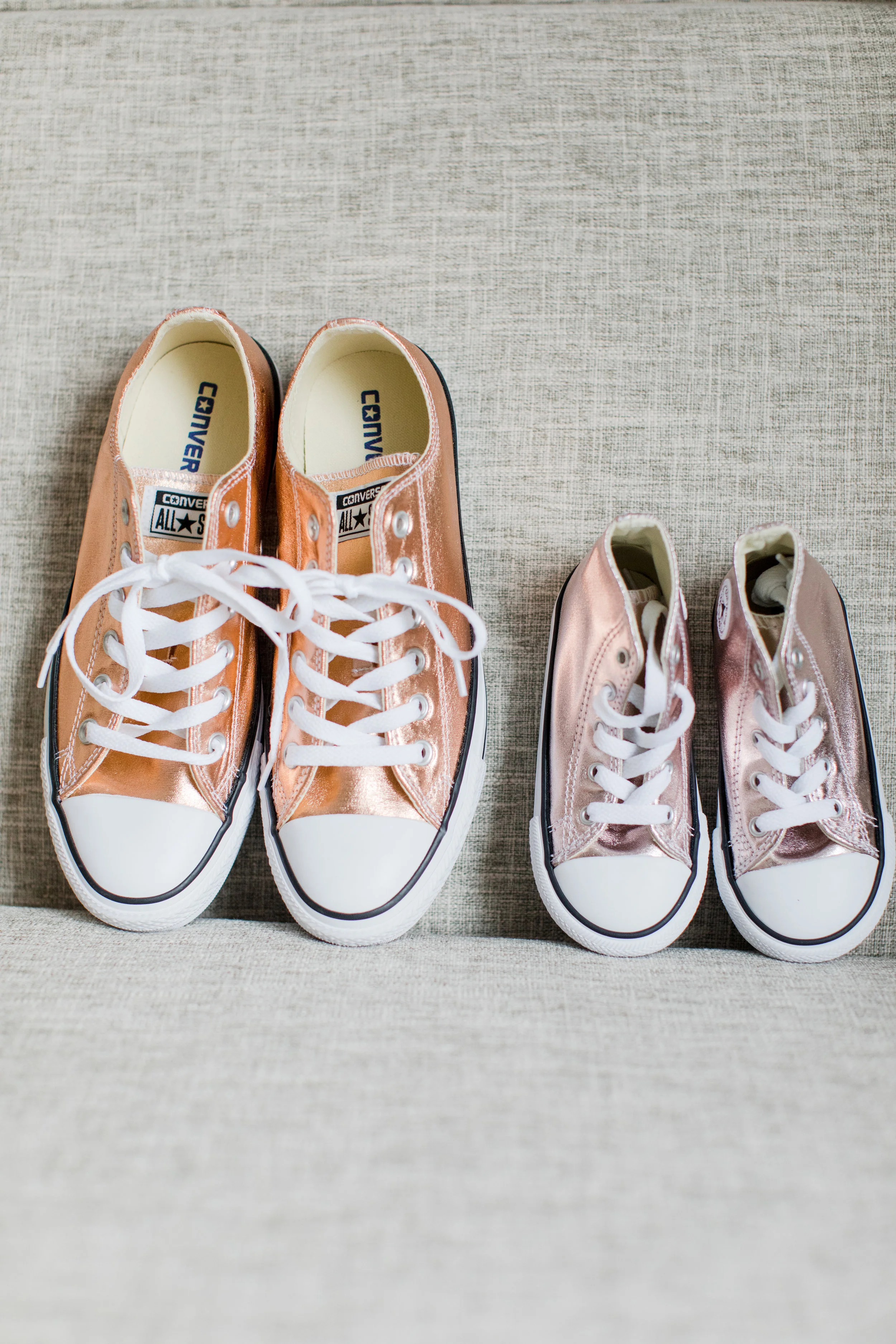 rose gold converse wedding shoes with matching rose gold converse flower girl shoes photographed by jaye kogut