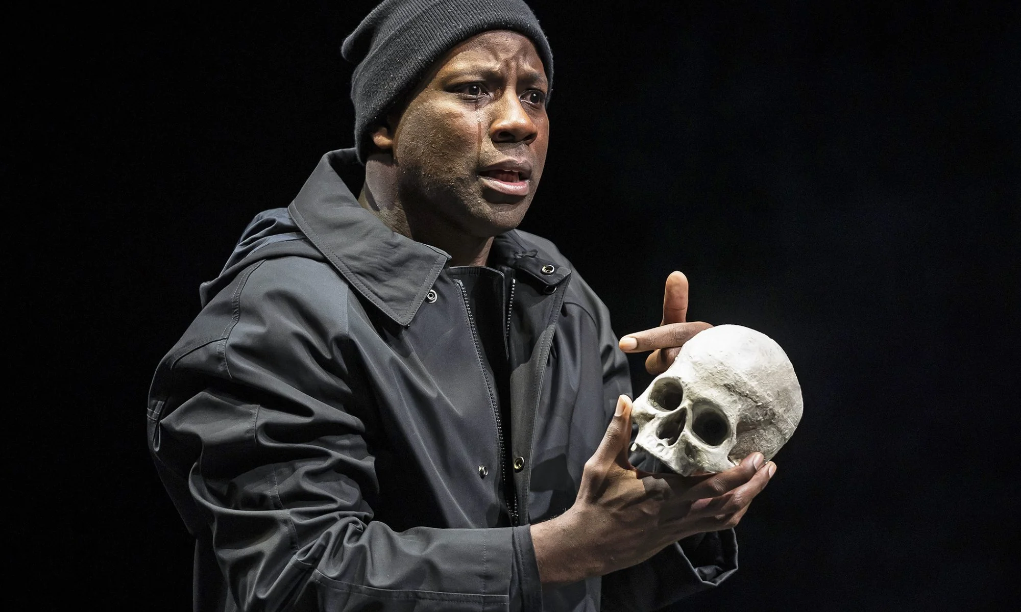 Maurice Jones, seen here with “dear Yorick,” is Hamlet, prince of Denmark.