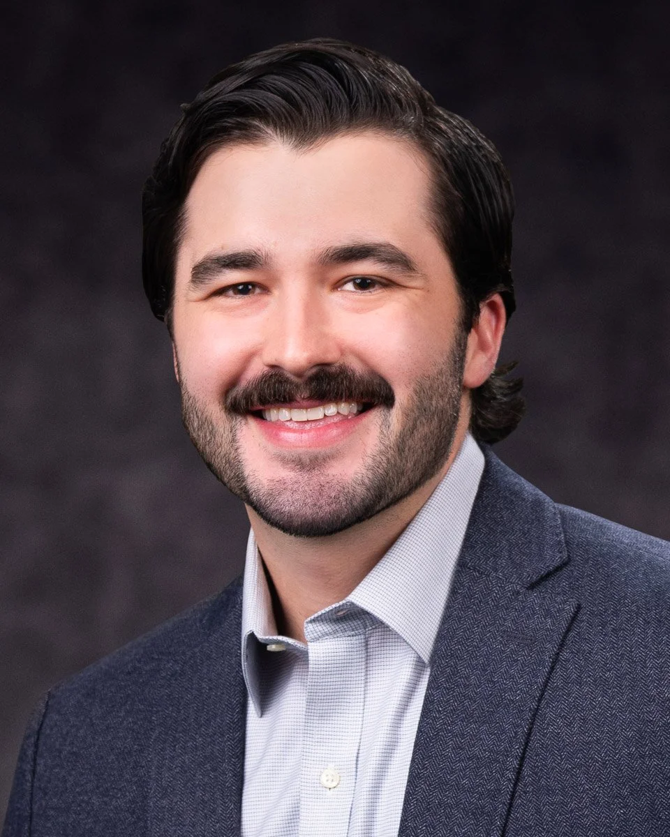 Wolansk_Sam_Grey_Wide_Headshot_LR.jpg