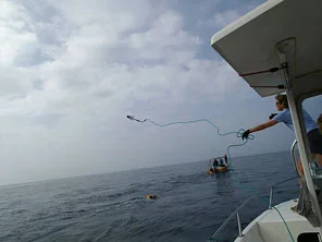 2012_12_06-2-Beth-throwing-grapnel-hook-for-Whale-Disentanglement-Training.jpg