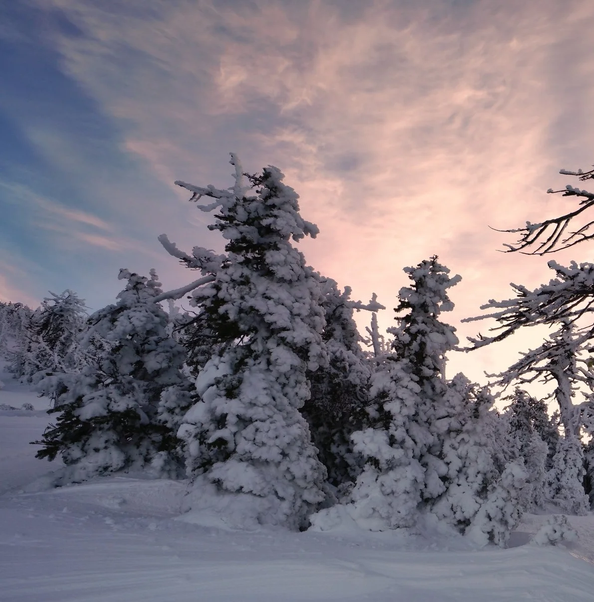 The winter view of Broken Top and Sisters
