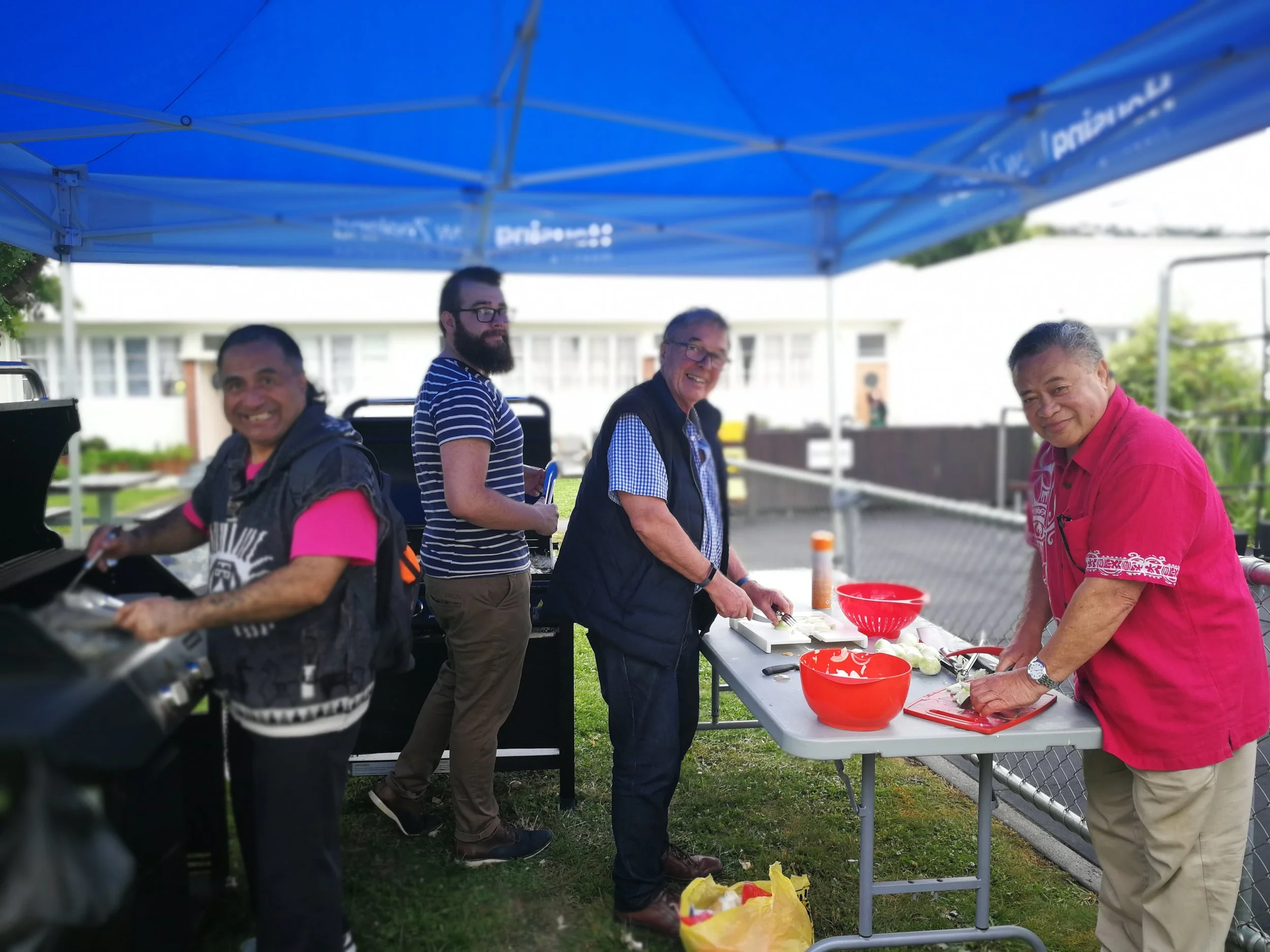 John Kennedy-Good, James Croach and friends helping at the Berhampore Community Center Christmas lunch.