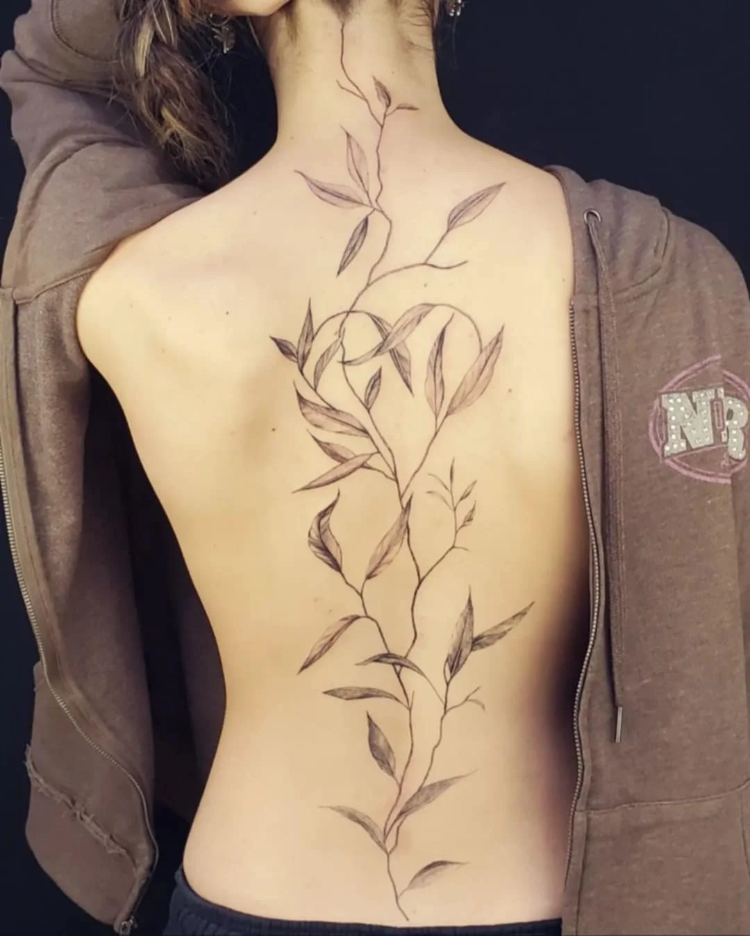 A fine line botanical tattoo completed at a down Spokane tattoo shop.
