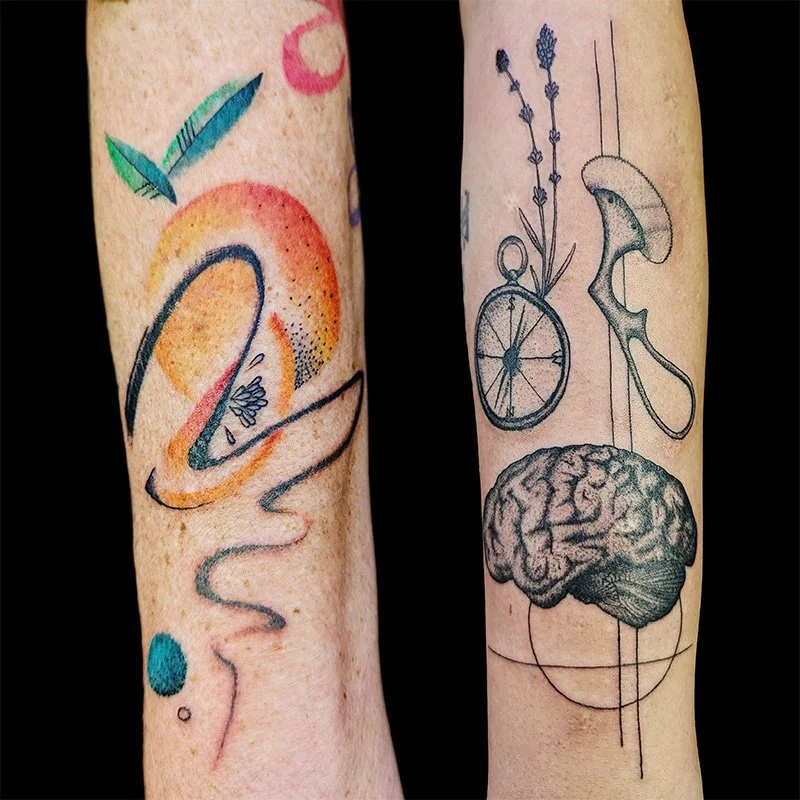 Abstract tattoo design in Spokane, Washington by tattoo artist Antonio Pacot.  It features 2 forearm tatoos, one with no hard lines and colorful swirls, and the other is surrealism abstract with multiple symbols and a black pointalism brain.