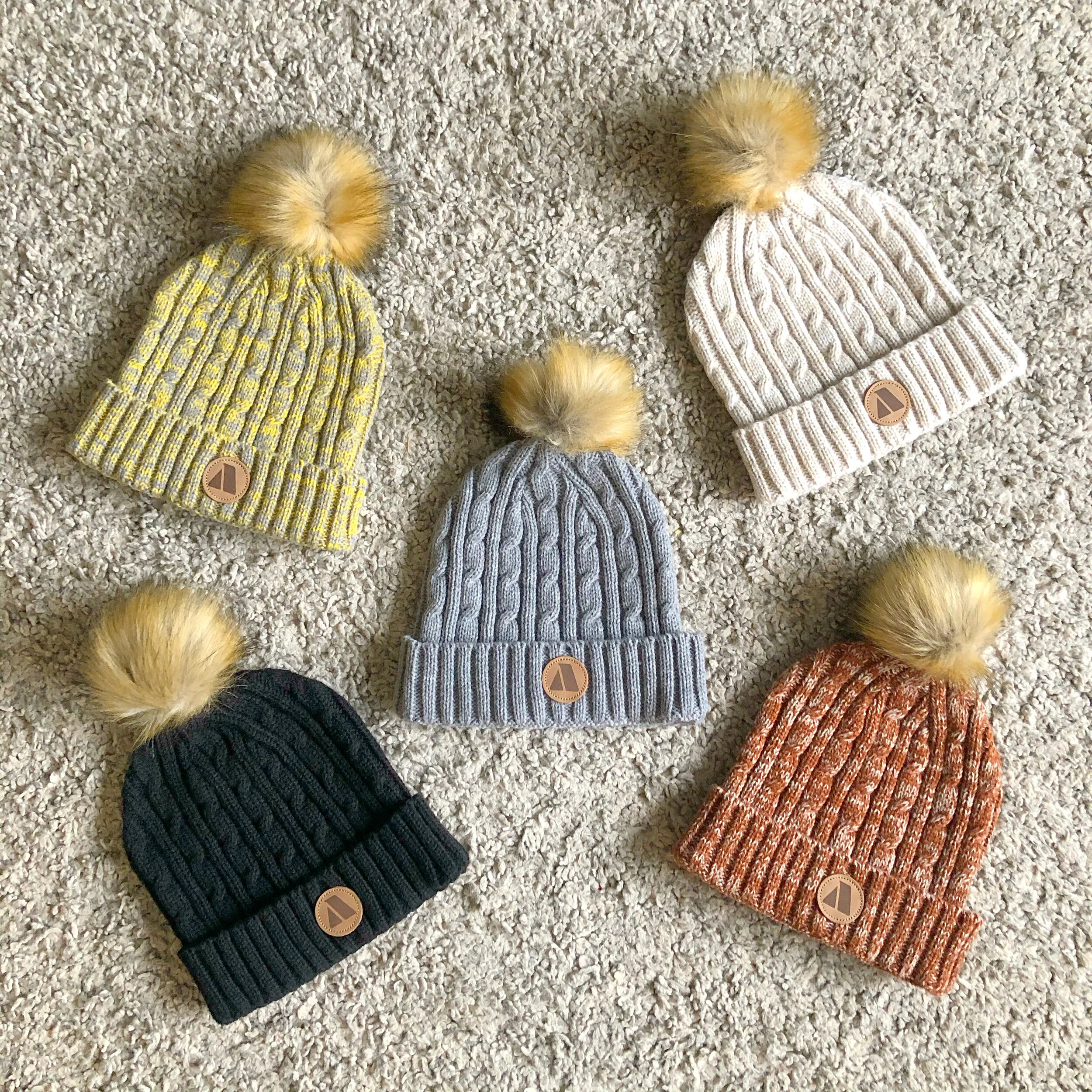 women's toques with pom pom