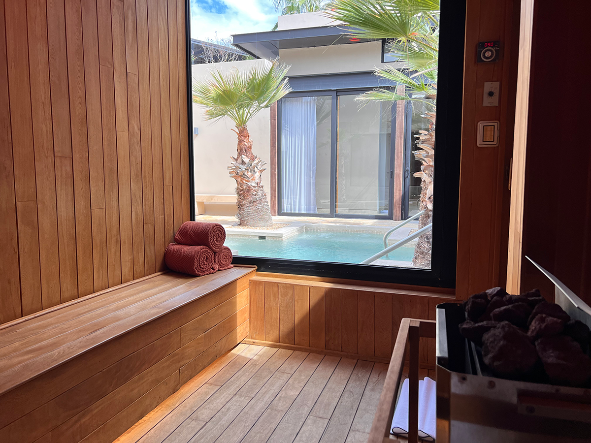 Sauna with a view of a plunge pool at Sensei Wellness Center.
