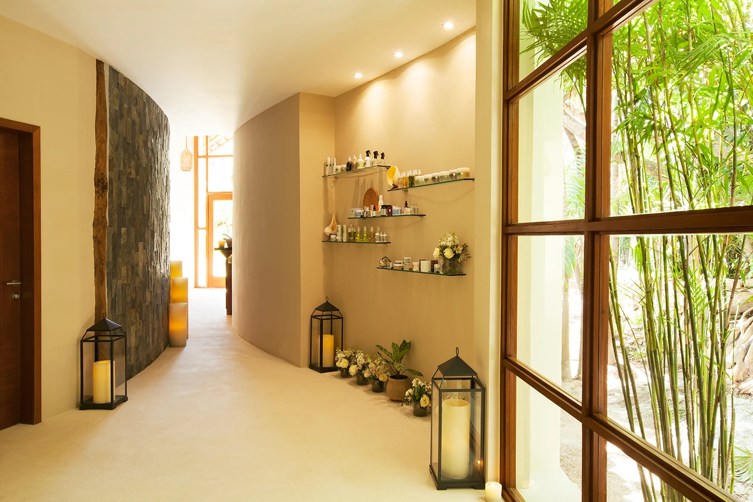 The spa features antique wood furniture, subtle lighting and louvered windows.