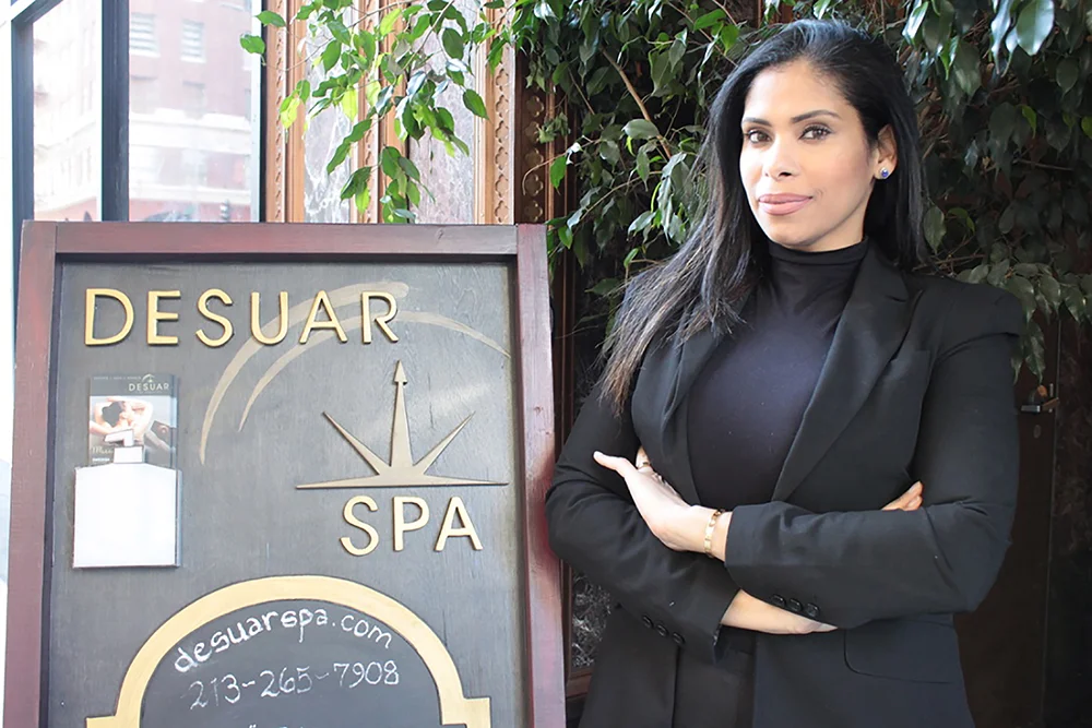Desuar Spa Founder Deisy Suarez in front of the entrance to Desuar Spa.