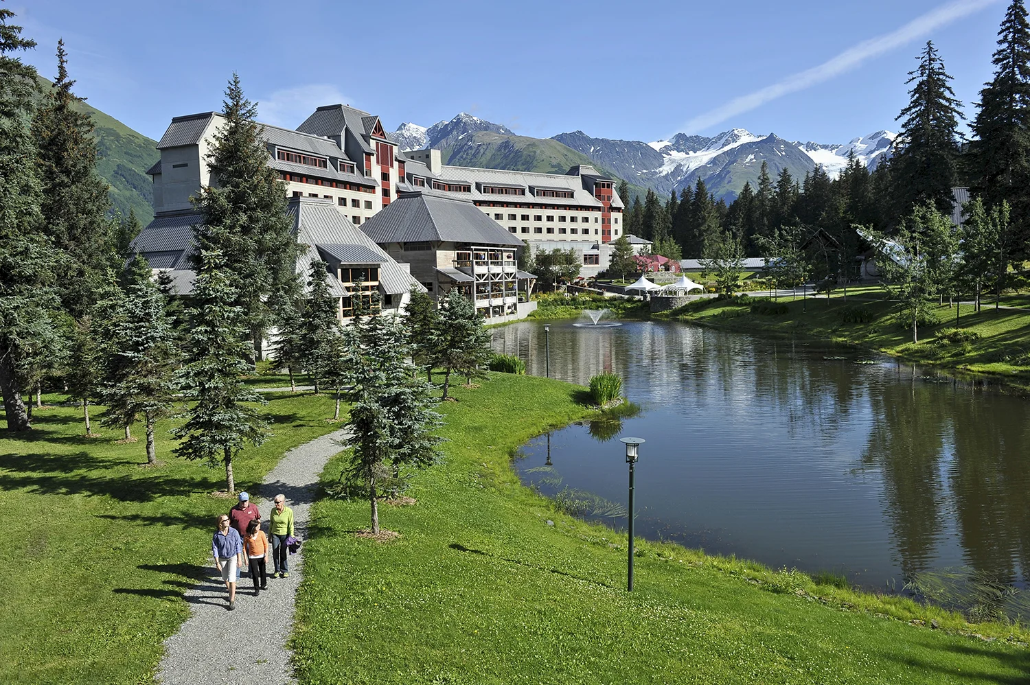 The chateau-style hotel is set in a lush valley surrounded by mountain peaks, hanging glaciers and ocean views.