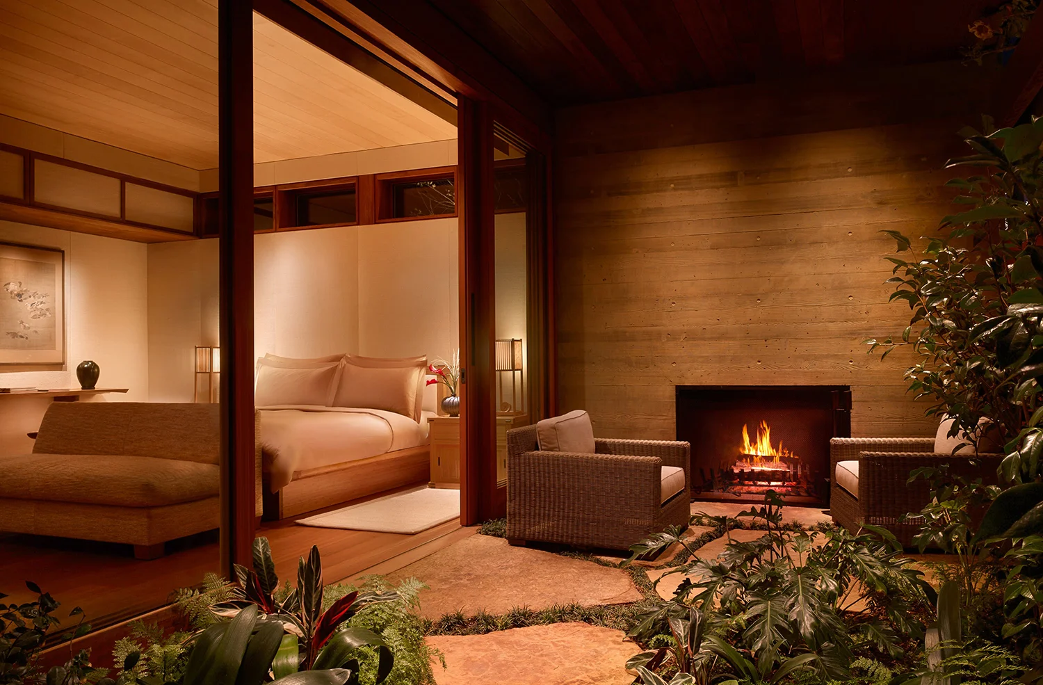 A private outdoor fireplace in the patio of one of the garden suites.