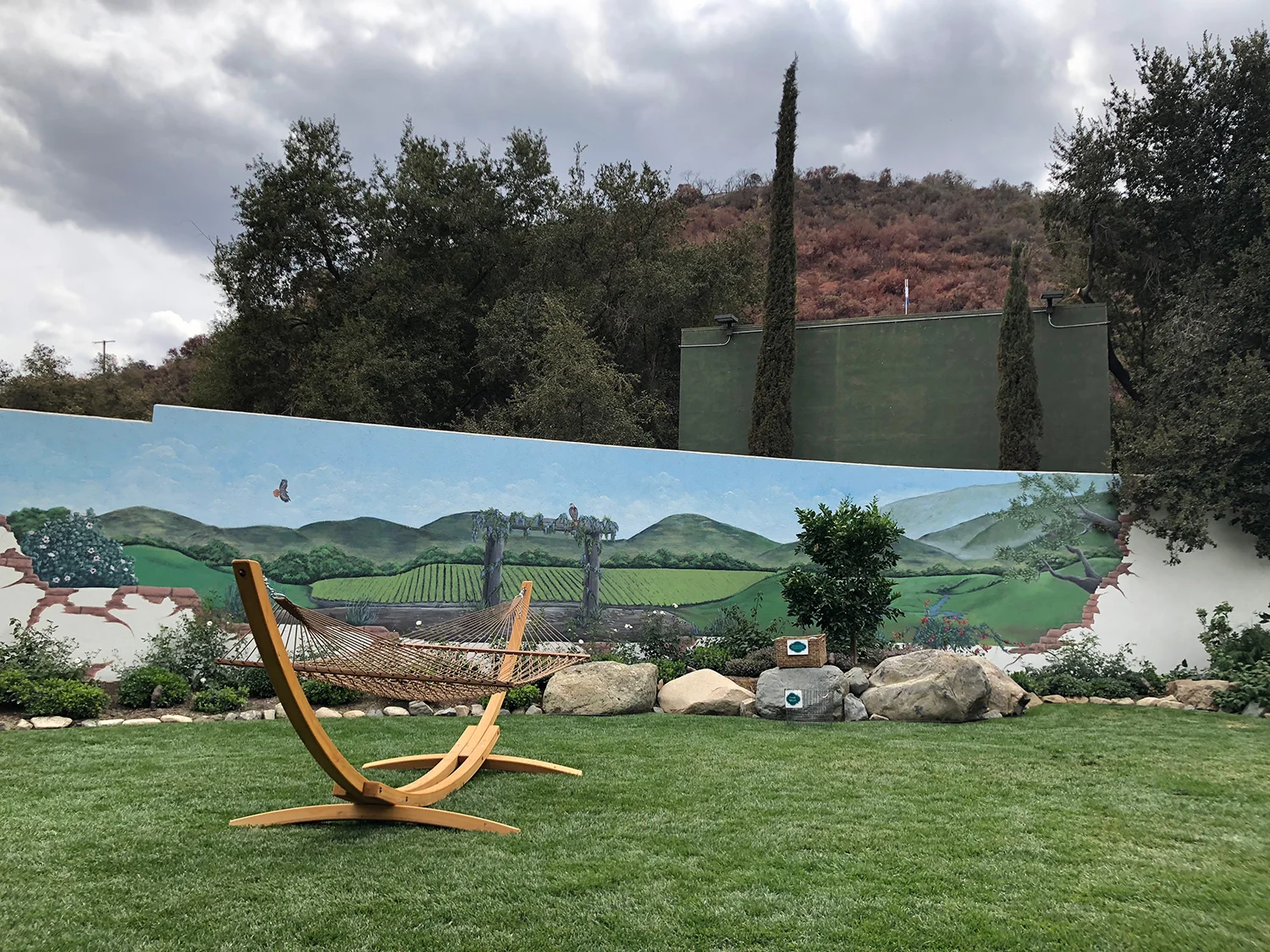 The Secret Garden is a relaxed, secluded area with fountains, a sunny lawn, hammock and shaded deck.