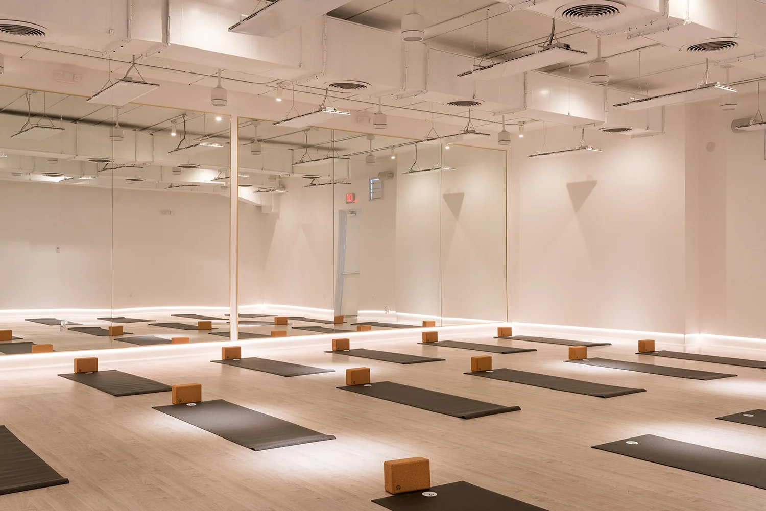 The completely renovated space includes two infrared-heated yoga and workout studios, and offers yoga classes for all levels and backgrounds.