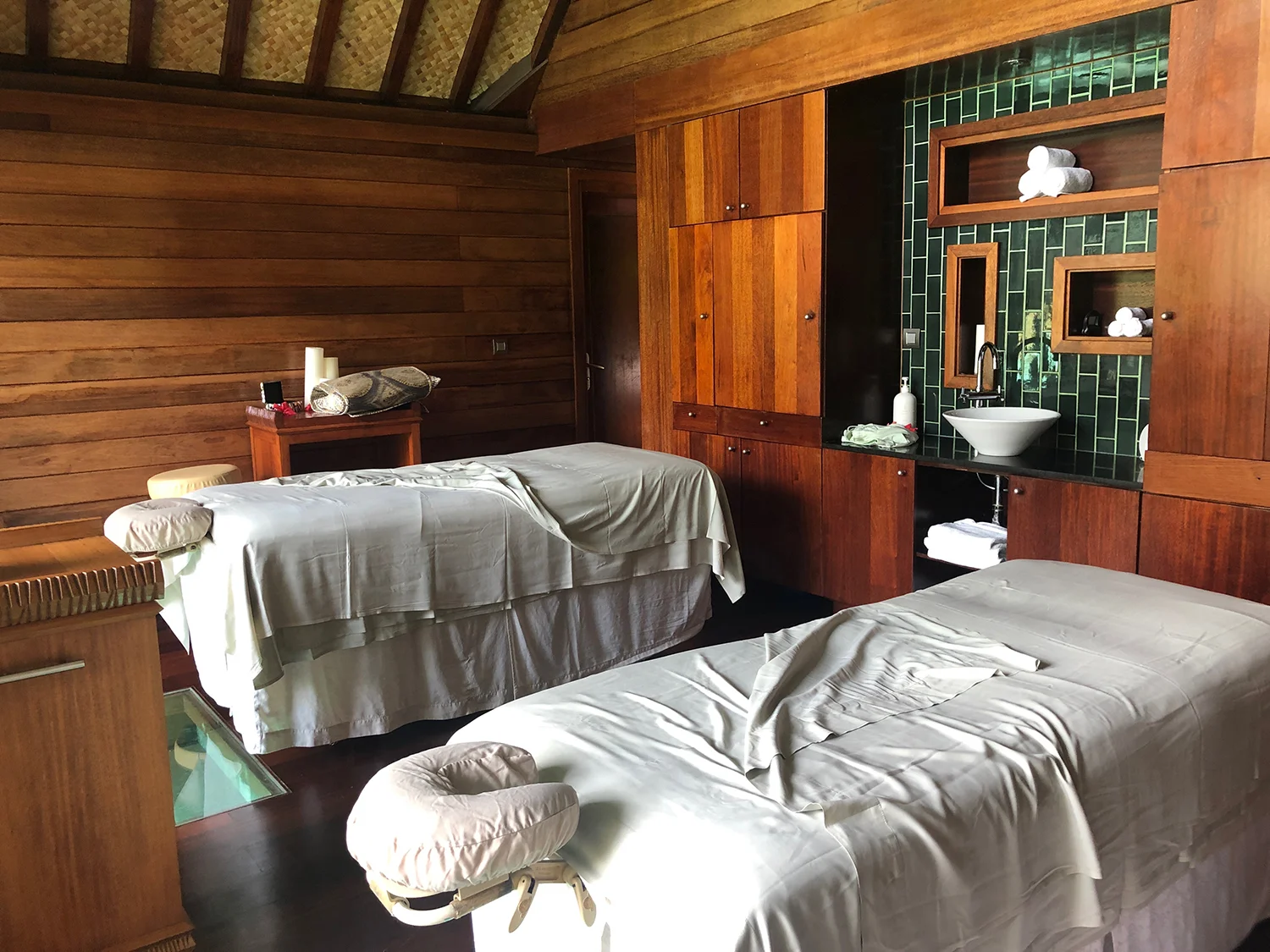 Treatment beds sit on glass panels above the lagoon.
