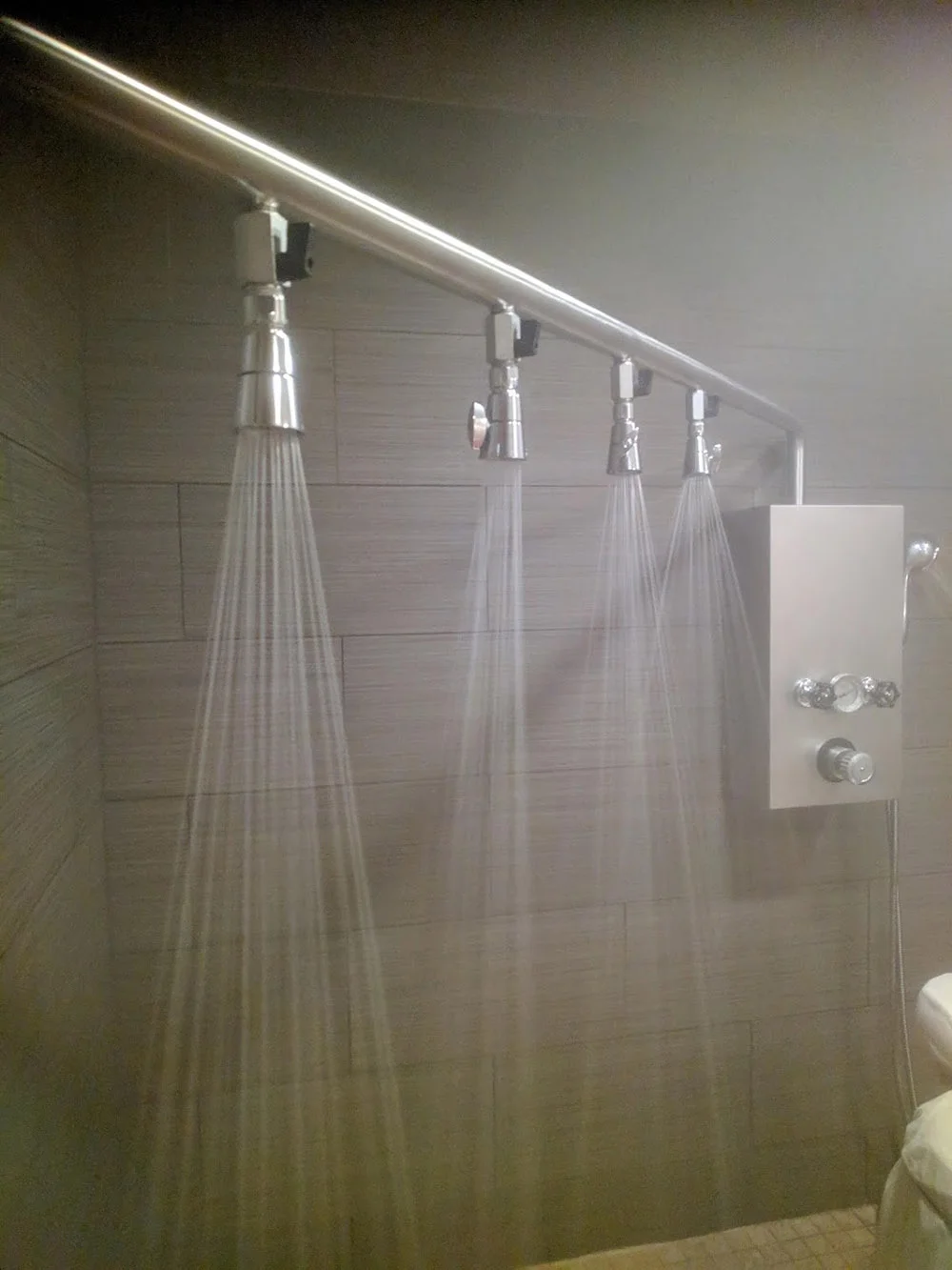 A close-up of the spa’s Vichy shower as a staff member prepares the room for a body treatment.