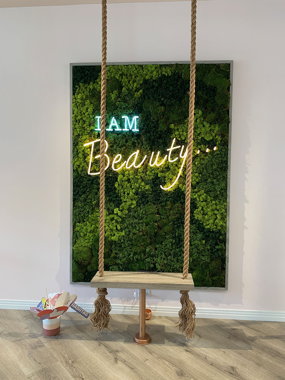 A cute corner where many happy clients take photos after their treatments.