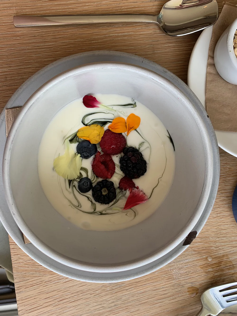 The house-made Lemon Chlorophyll Yogurt with house hemp granola and market berries.