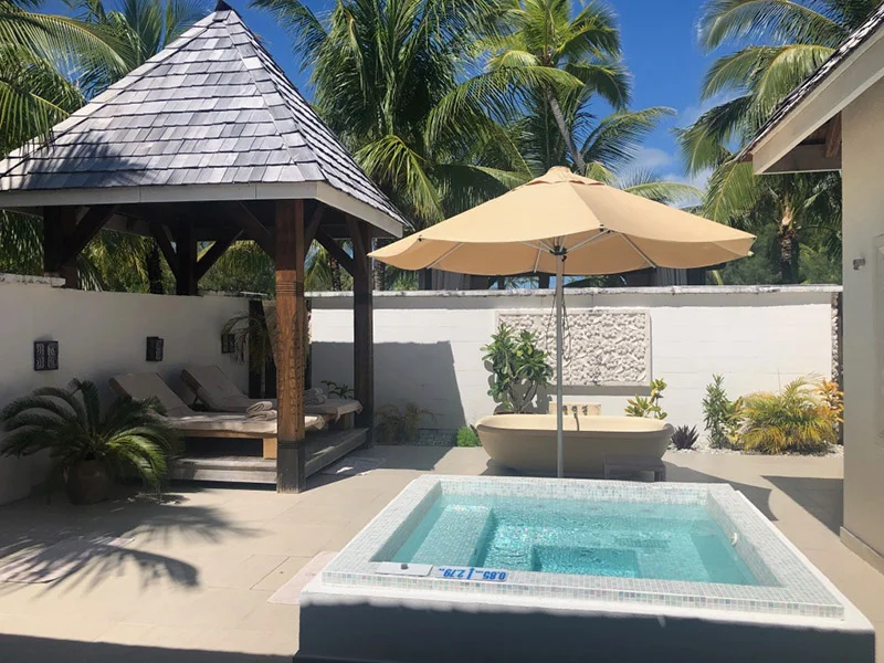 The other private wellness area has a jacuzzi and shaded cabana.