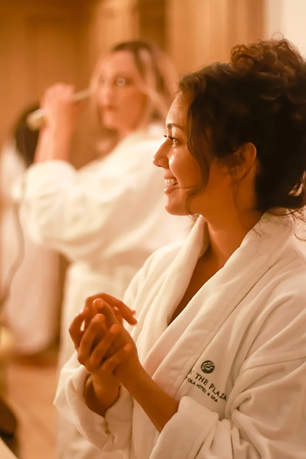 Guests relax in comfortable robes during their spa visit.
