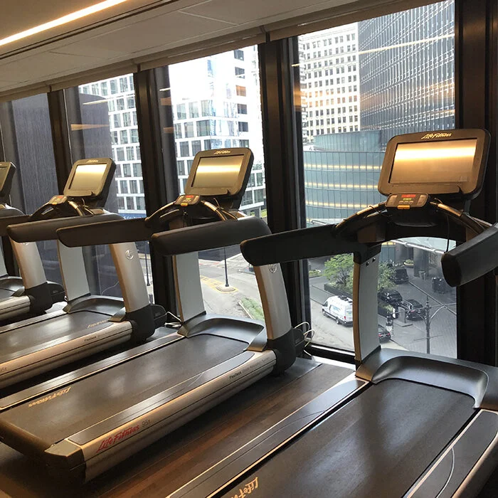 The fitness room offers a view of the city while working out.jpg