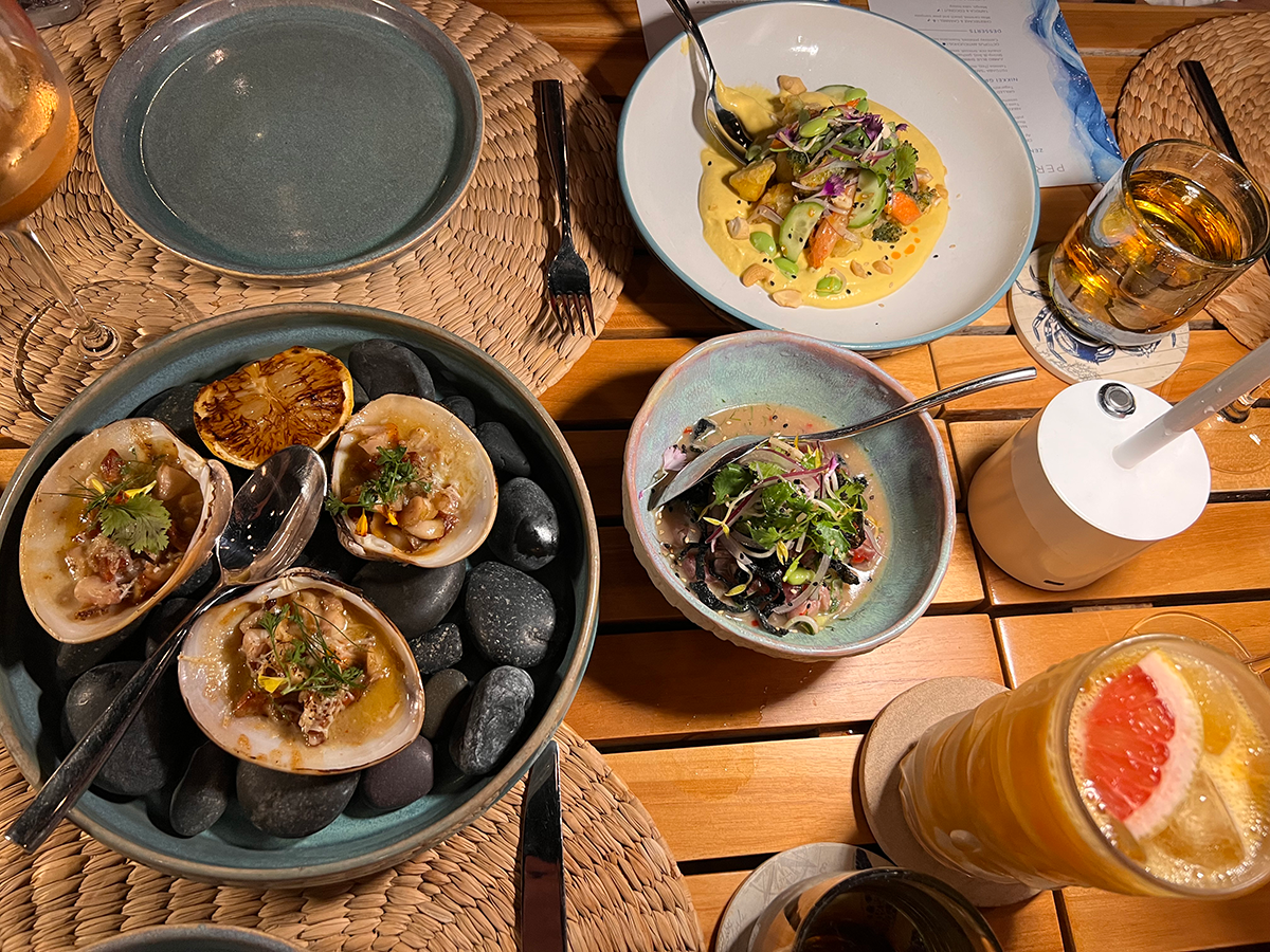 Appetizers at Equis: Grilled clams and ceviche.