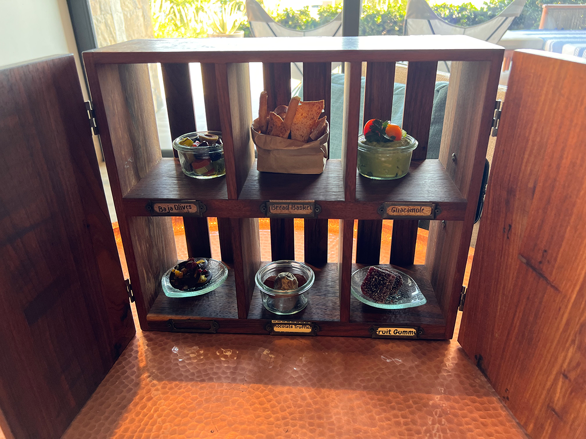 A welcome snack featuring an assortment of sweet and savory snacks.