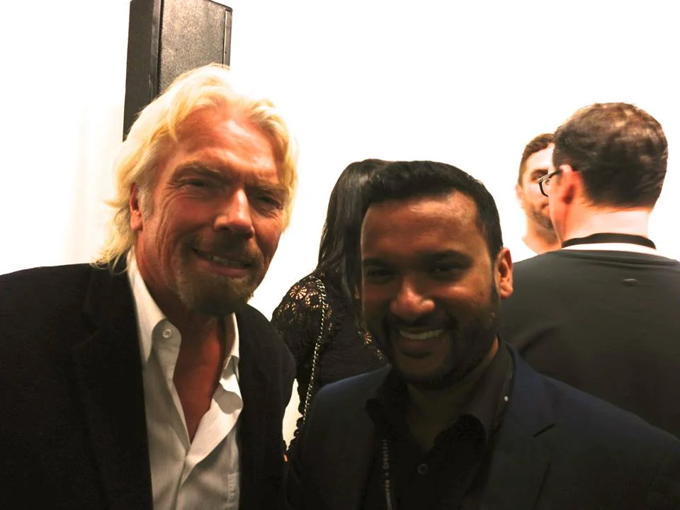 Afdhel meeting one of his heroes, Sir Richard Branson at the C2 Montreal Conference.